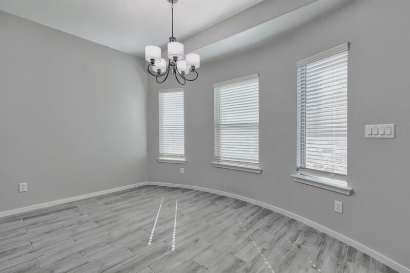 dining room with chandelier and windows