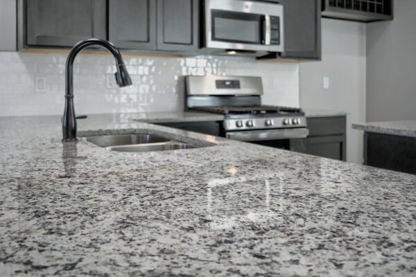 Kitchen countertop close‑up with granite surface