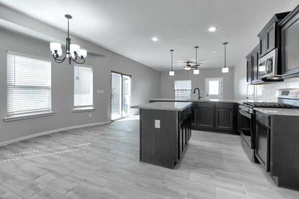 Kitchen and dining area with island and chandelier