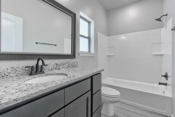 Master bathroom with double sinks and mirror