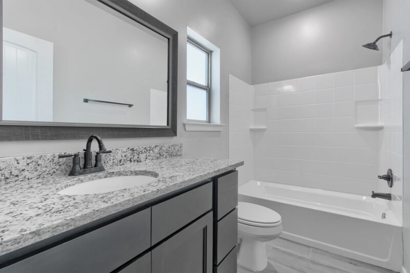 Master bathroom with double sinks and mirror