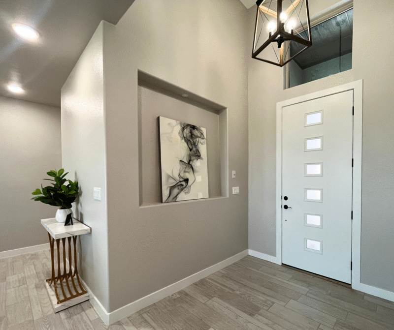 Modern home entryway with front door and decor