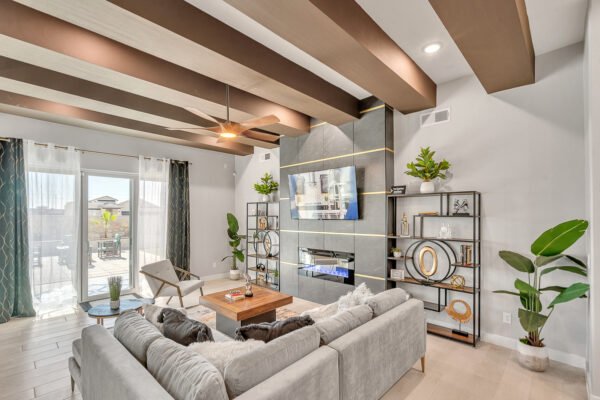 Stylish living room with sofa, fireplace wall, and sliding patio doors