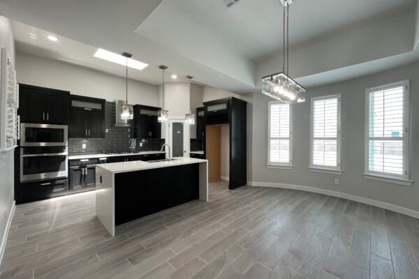 Cornor View Open kitchen and dining area with island and pendant lights