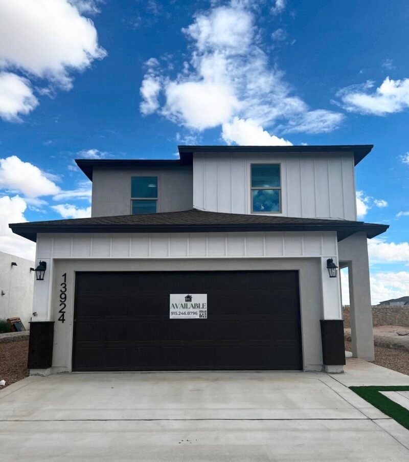 Front exterior of a new modern two‑story home with garage