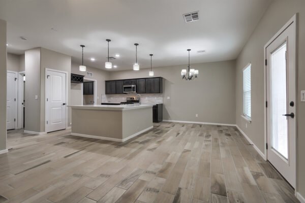 kitchen with a large island, dark cabinets