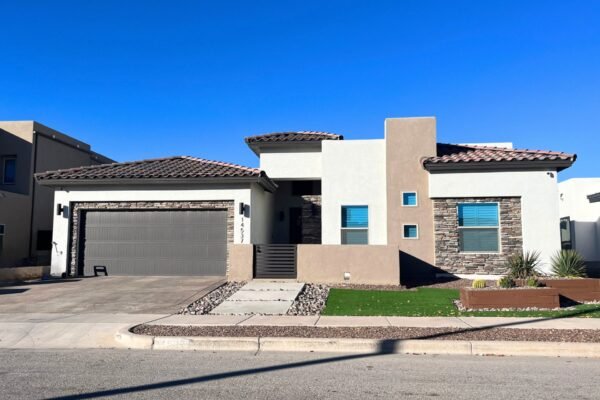 Front exterior of the Majorca model home with garage and stone accents