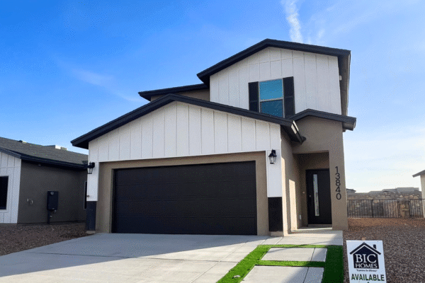 Two‑story modern home exterior with garage and driveway
