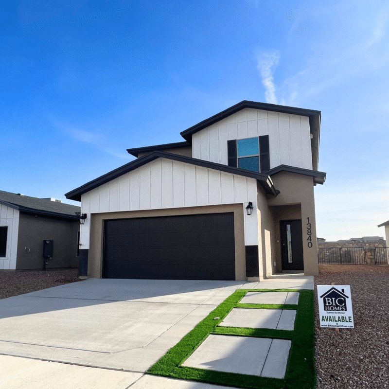 Two‑story modern home exterior with garage and driveway